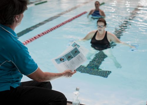 Woman swimming in water doing therapy