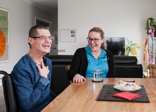 An occupational therapist in the Mandurah clinic laughs with her client Image