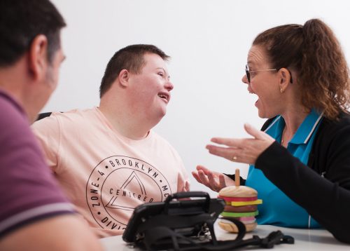 An NDIS occupational therapist talks to a client at the Kern Allied Health clinic